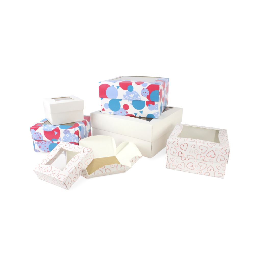 A selection of our easy-to-assemble, flat pack cake boxes in small, medium, large and extra large. Available in spotty Bauble, Light Heart and white