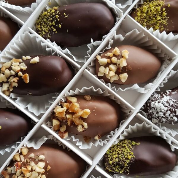 16 Cavity Square Slotted Divider with a selection Chocolate dates with nut decoration