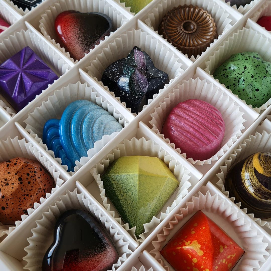 36 Cavity Square Slotted Divider with a selection of colourful multi-shaped chocolate Truffles