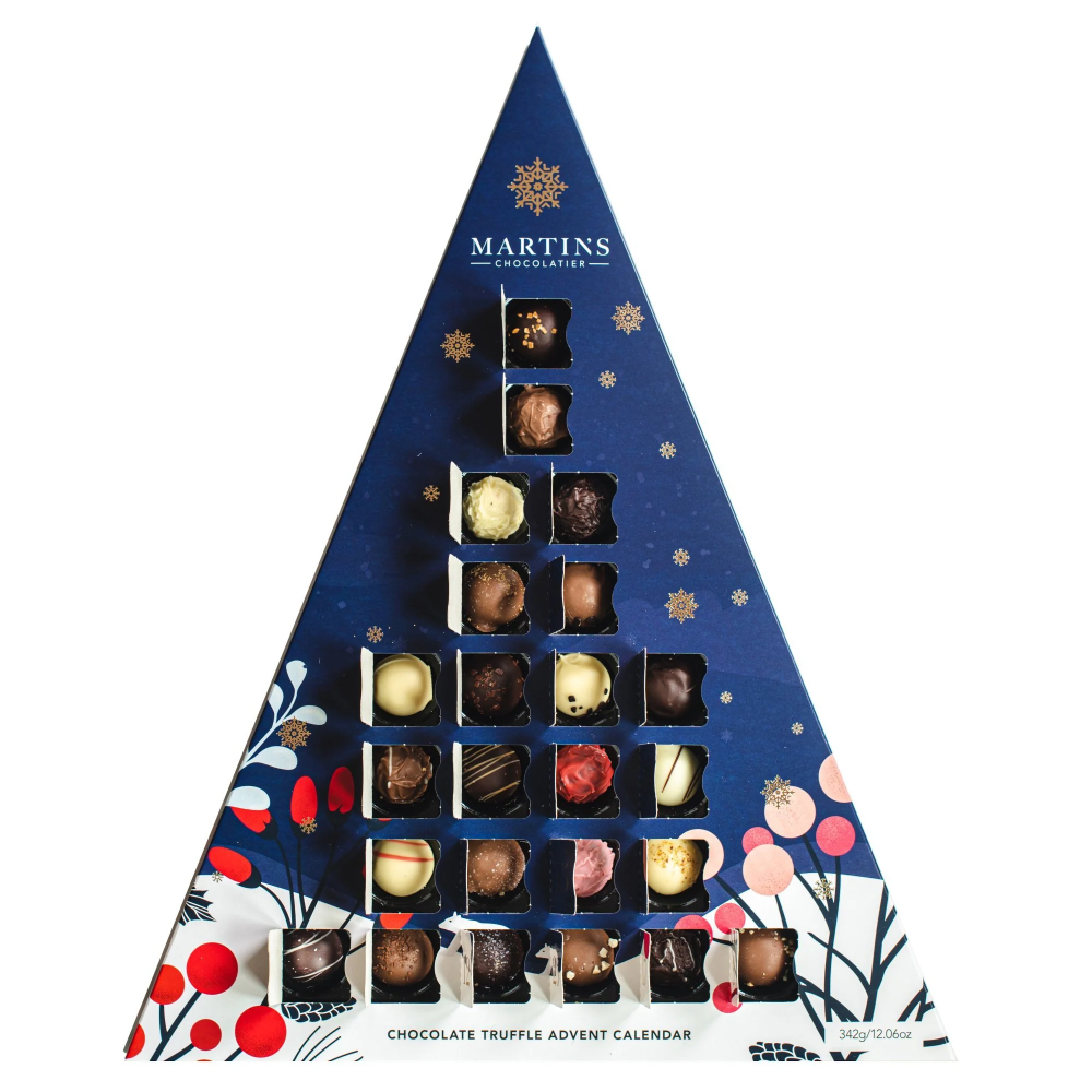 Martins Chocolatier's Blue Triangle 24 Day Advent Calendar with Bright Gold foil detailed snowflakes & numbers. In a festive winter scene. Chocolate artisan truffles on display in windows